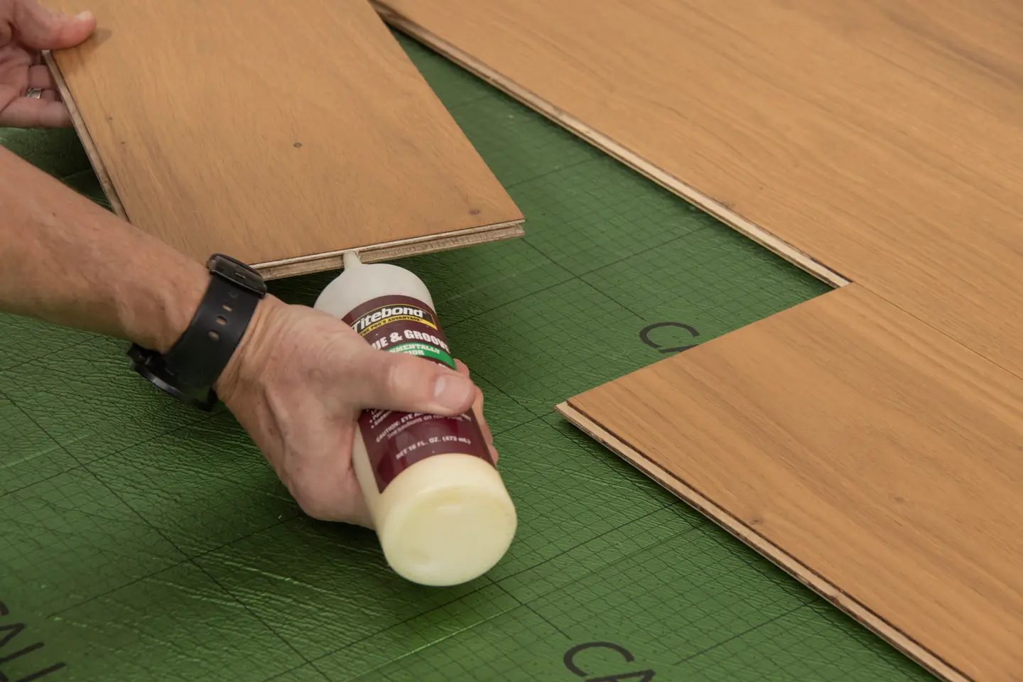 Vintage Vine hardwood plank installation detail — showing the value of professional restoration vs full replacement