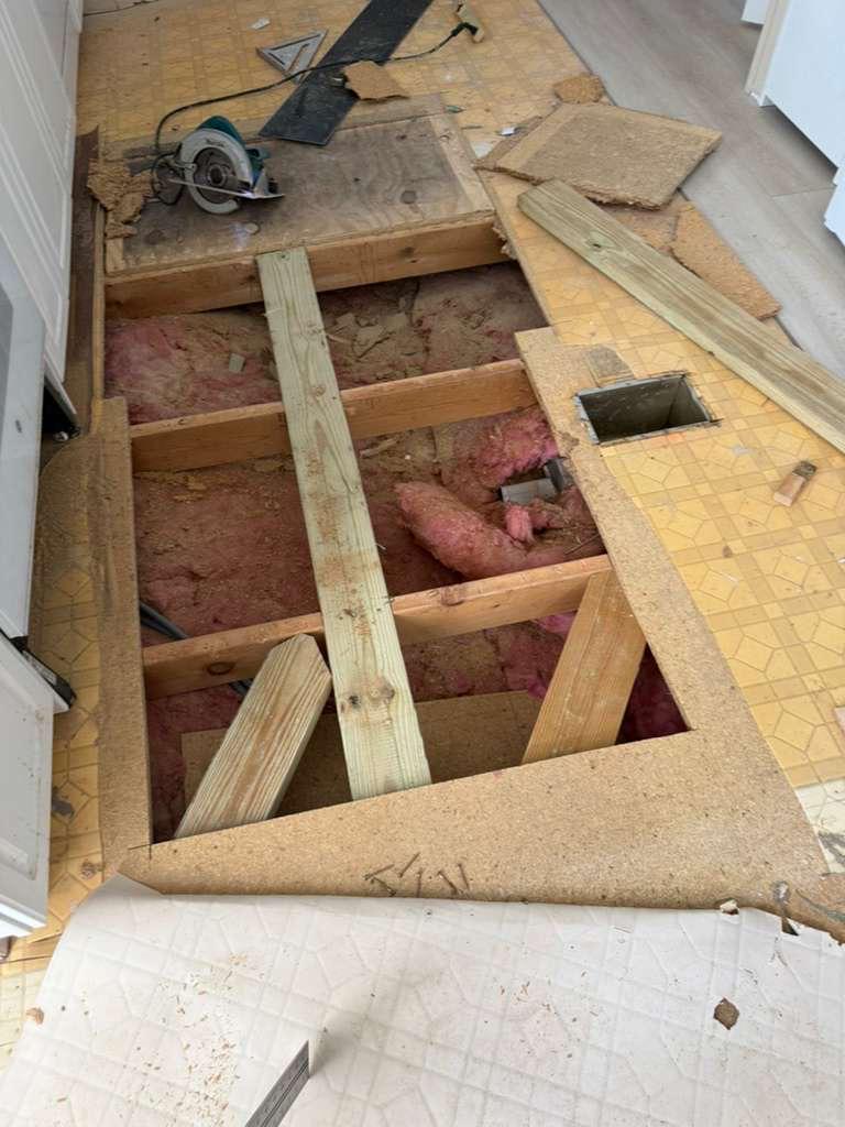Damaged subfloor opened for removal in Winter Garden, FL