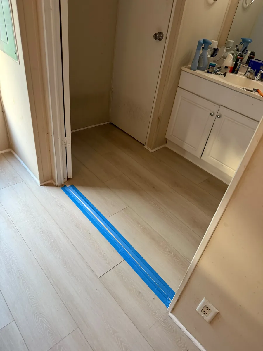 Vinyl flooring transition at a Winter Garden bathroom doorway