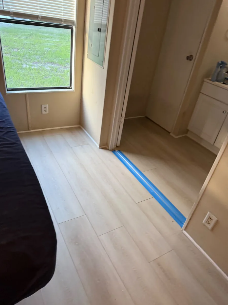 Vinyl flooring transition at a Winter Garden bedroom doorway