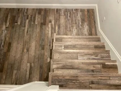 Residential LVP Stair Installation Orlando FL Residential LVP stair installation with matching treads and nosing in Orlando