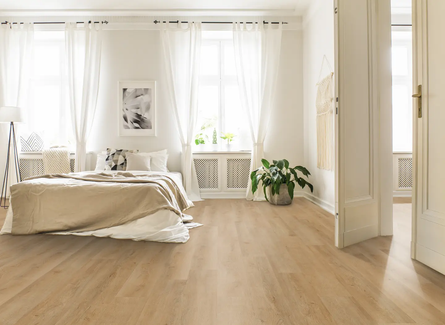 Catamaran luxury vinyl plank flooring installed in an Orlando home — warm wood-look planks with coordinated trim and transitions